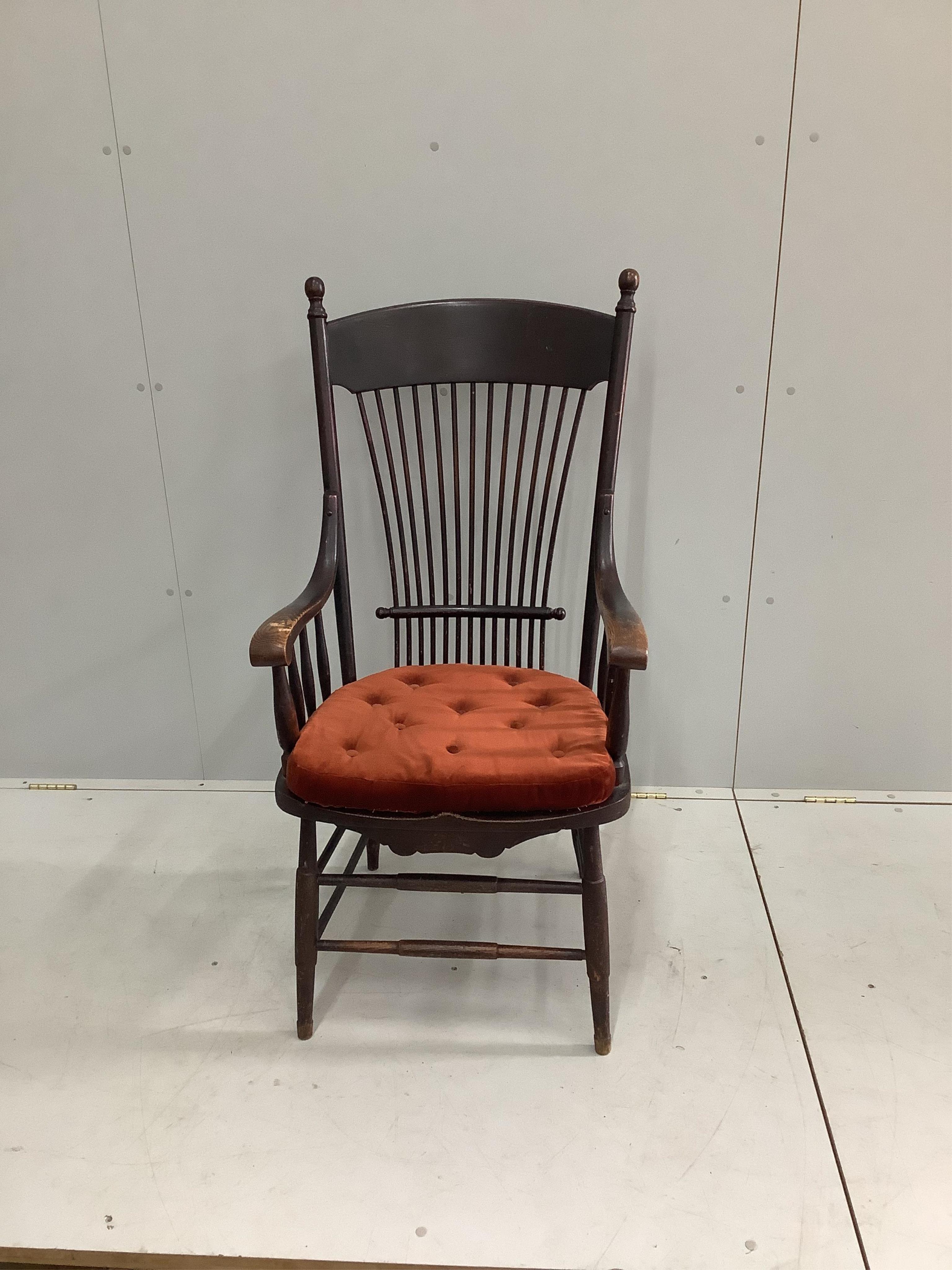 An early 20th century American ash armchair, width 60cm, depth 46cm, height 114cm. Condition - fair